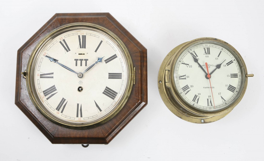 Two Wall Clocks, Junghans and Emory & Douglas, Wi: Two Wall Clocks, Junghans and Emory & Douglas, one having an octagonal mahogany case and the other a brass ship's clock, each having a circular dial with Roman numeral hours. Width of widest 11 inches