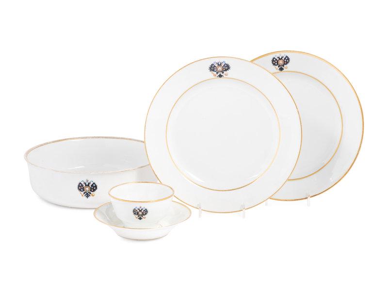 A Group Three Imperial Porcelain Factory Porcelain Table Articles: A Group Three Imperial Porcelain Factory Porcelain Table Articles Dated 1883 and 1913 each decorated with gilt rims and a double-headed eagle crest, comprising a pair of Nicholas II dinner plate
