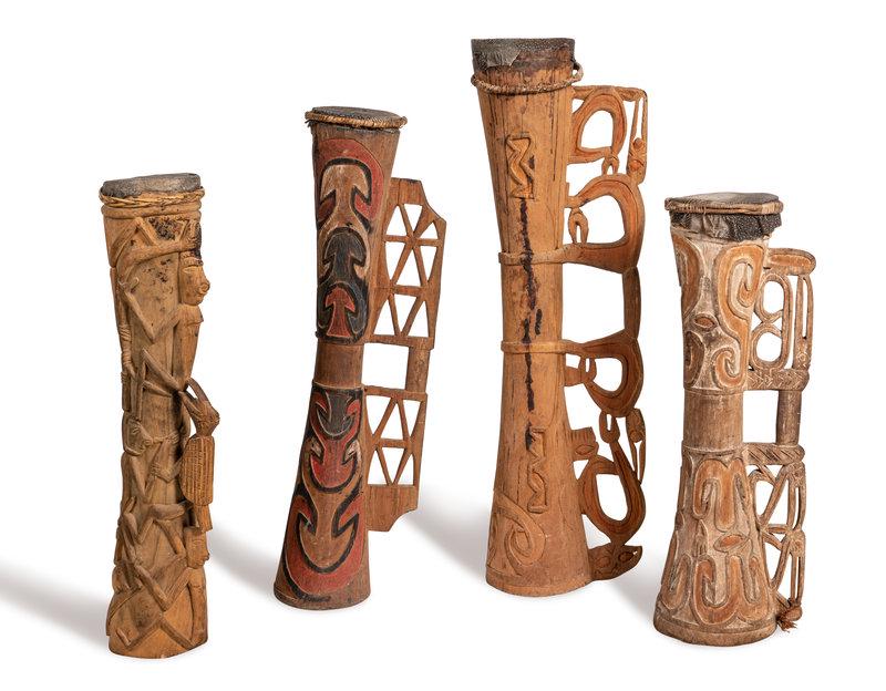 Four Asmat Drums: Four Asmat Drums Papua New Guinea, Circa 20th Century A.D. Height of tallest 41 inches (104.1 cm). This lot is located in Chicago. Property being sold to benefit the Mission and Visi