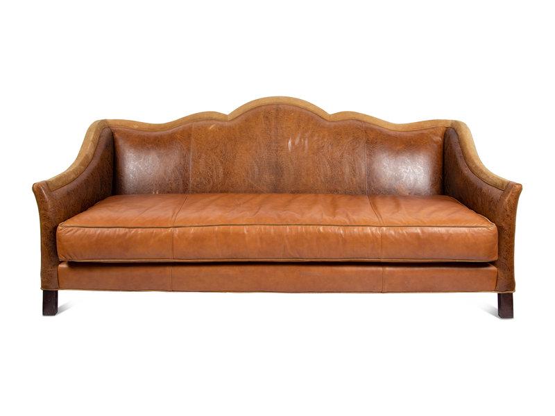 A Custom Leather Upholstered Camelback Sofa: A Custom Leather Upholstered Camelback Sofa 20th Century manufactured by old hickory tannery, with suede and embossed foliate accents. Height 38 x width 86 x depth 36 inches. This lot is loc