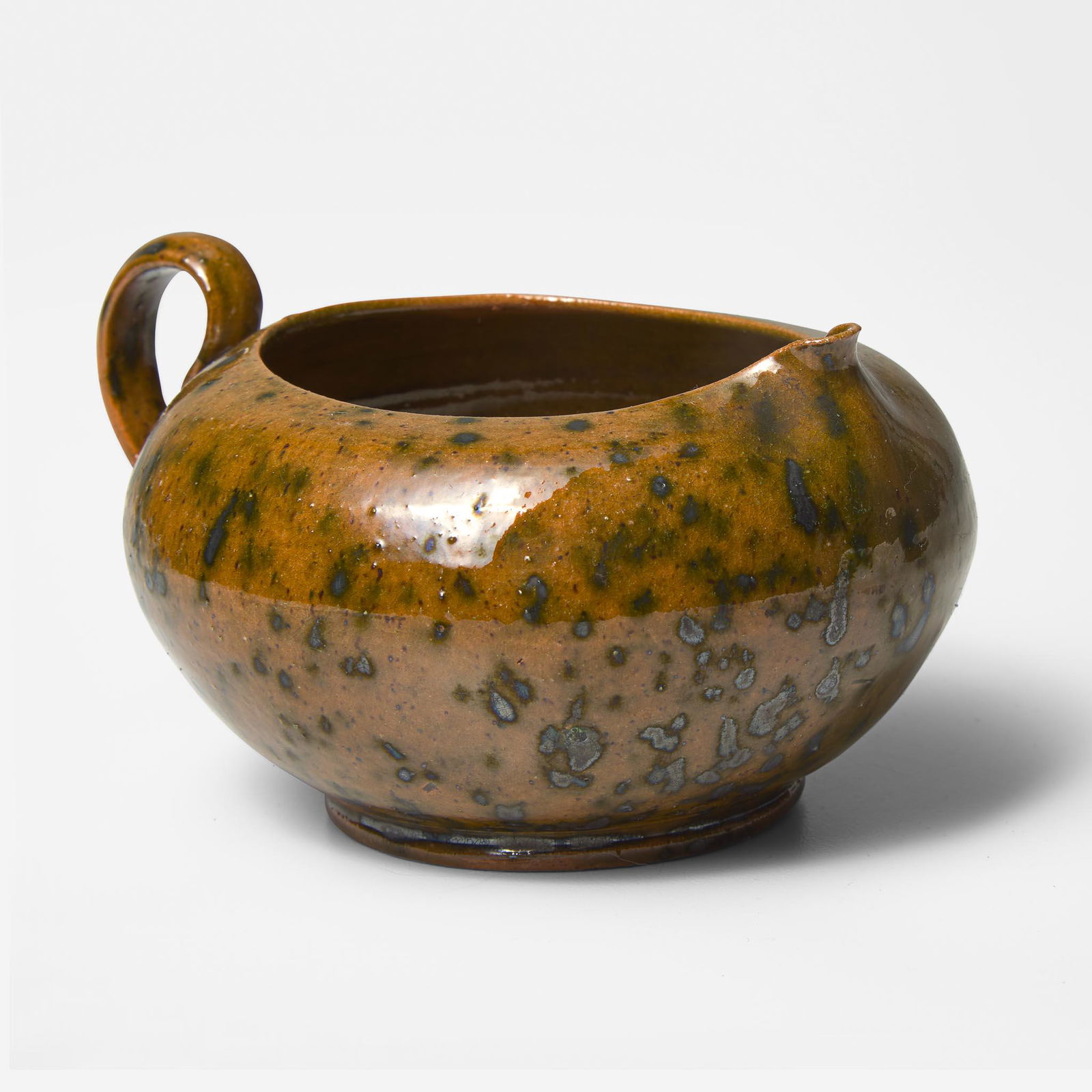 George Ohr (American, 1857-1918) Pitcher in Spotted Olive and Speckled Brown Glaze, Biloxi,: George Ohr (American, 1857-1918) Pitcher in Spotted Olive and Speckled Brown Glaze, Biloxi, Mississippi, USA, circa 1897-1900 Glazed earthenwareImpressed to underside: "G.E. OHR, Biloxi, Miss." (H: 2