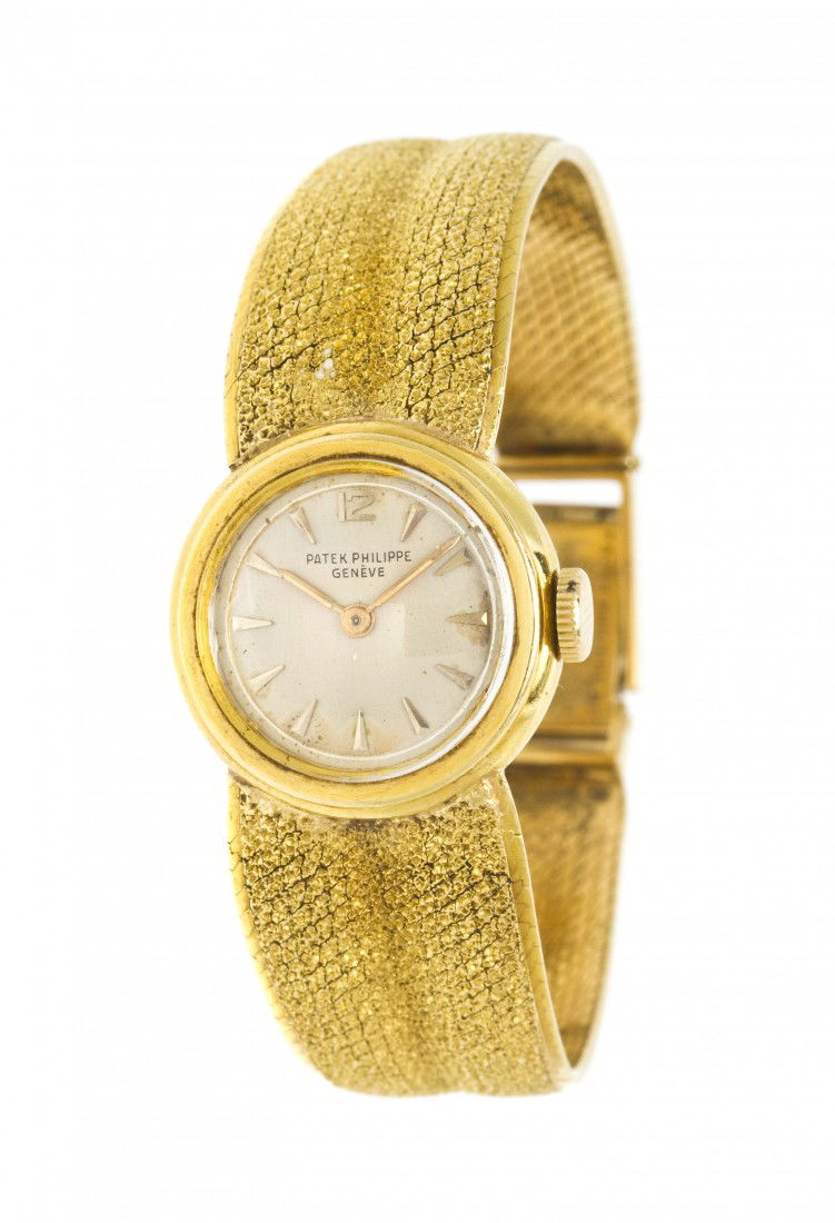 An 18 Karat Yellow Gold Mechanical Wristwatch, Pat: An 18 Karat Yellow Gold Mechanical Wristwatch, Patek Philippe, Circa 1947, 21.00 mm case diameter, matte silvered dial, applied gilt Arabic and index numerals, gilt baton hands, circular case, snap on
