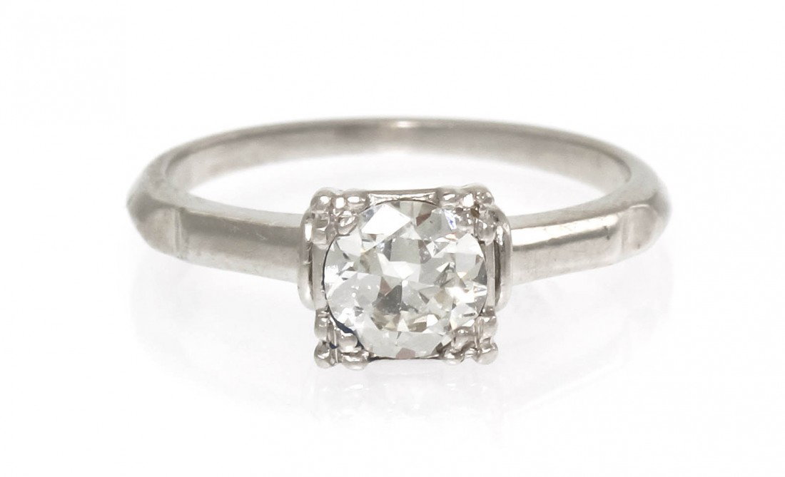 A Platinum and Diamond Solitaire Ring, 2.45 dwts.: A Platinum and Diamond Solitaire Ring, containing one round transitional brilliant cut diamond weighing approximately 0.53 carat. Stamp: 10% IRID MJK. 2.45 dwts.