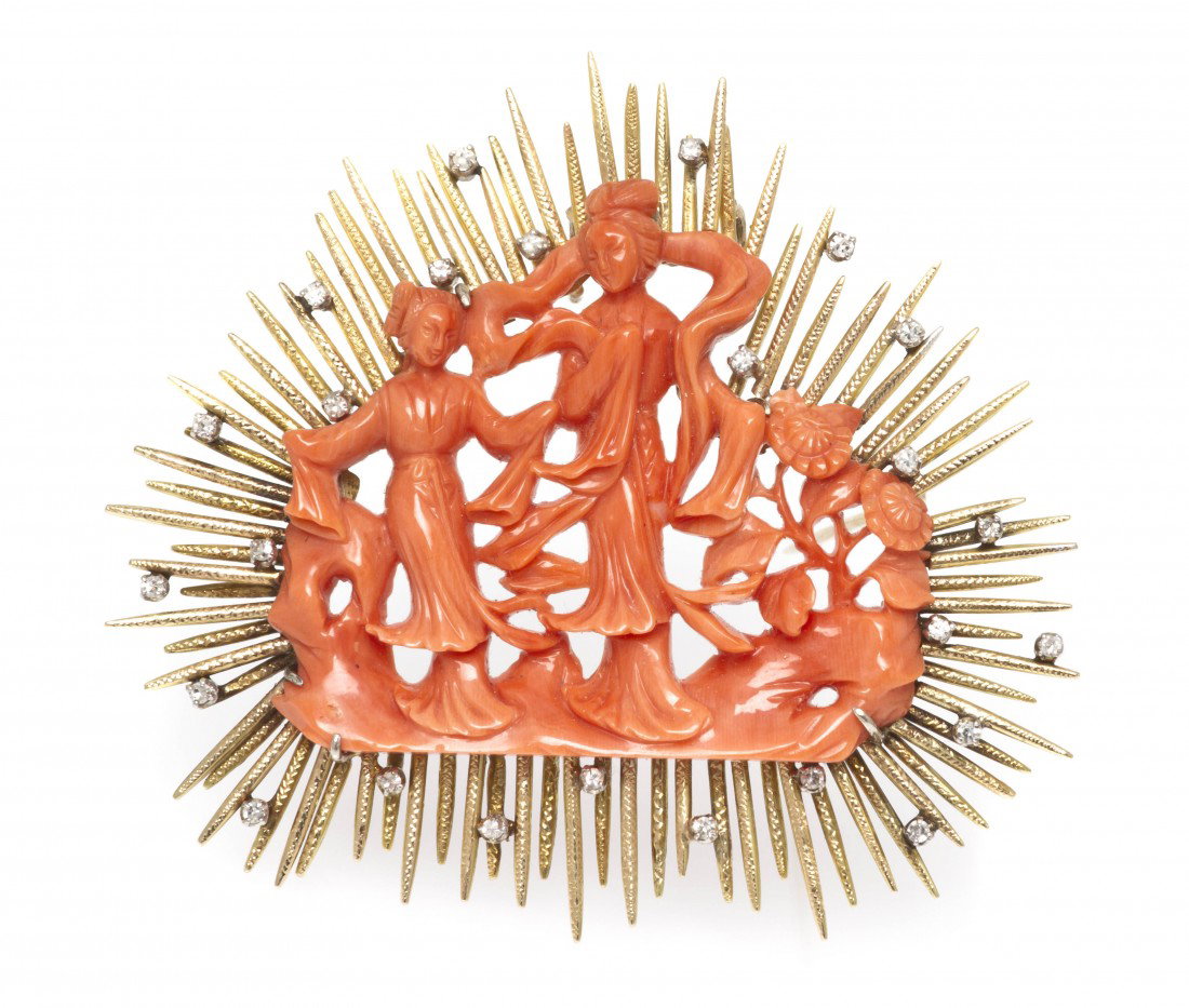 An 18 Karat Gold, Coral and Diamond Brooch, 19.30 : An 18 Karat Gold, Coral and Diamond Brooch, consisting of a central carved and pierced coral section depicting two Asian women in forest landscape within a wirework gold setting containing 24 round si