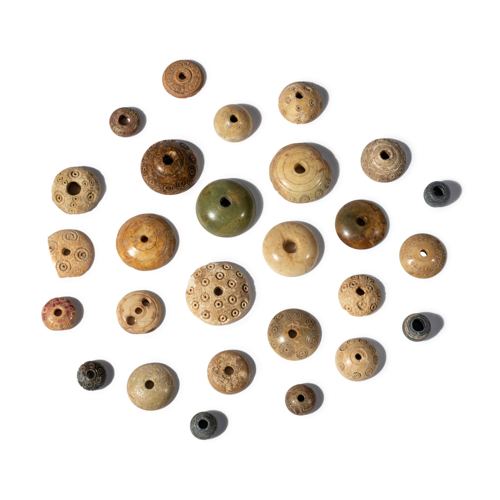 Twenty Seven Coptic Spindle Whorls: Twenty Seven Coptic Spindle Whorls Circa 5th-7th Century A.D. Width of largest 1 1/2 inches (3.8 cm). Property from the Museum of Fine Arts, St. Petersburg, Florida