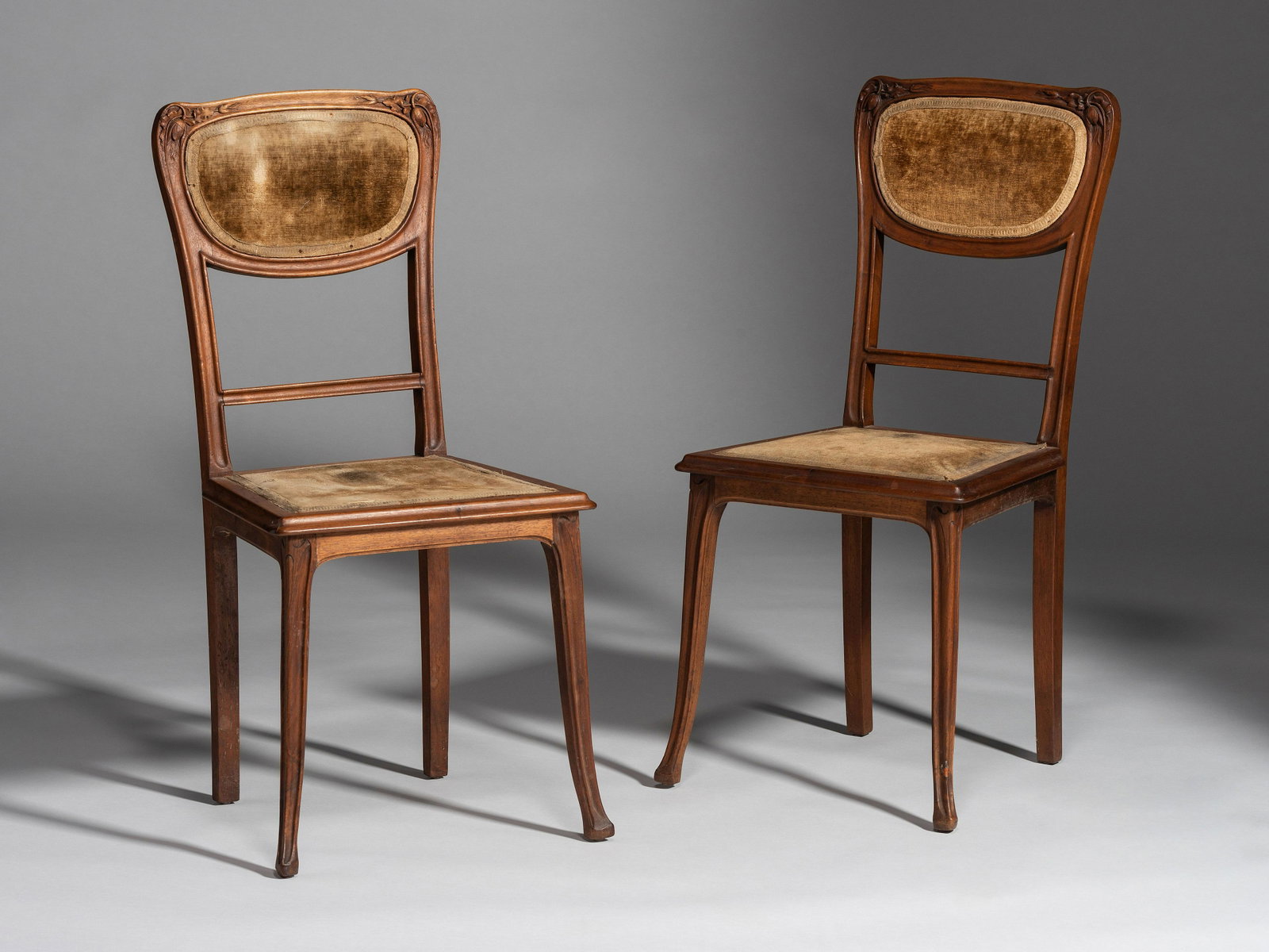 Manner of Louis Majorelle French, Early 20th Century Pair of Chairs: Manner of Louis Majorelle French, Early 20th Century Pair of Chairs carved fruitwood, upholstery H 36 inches. This lot is located in Cincinnati.