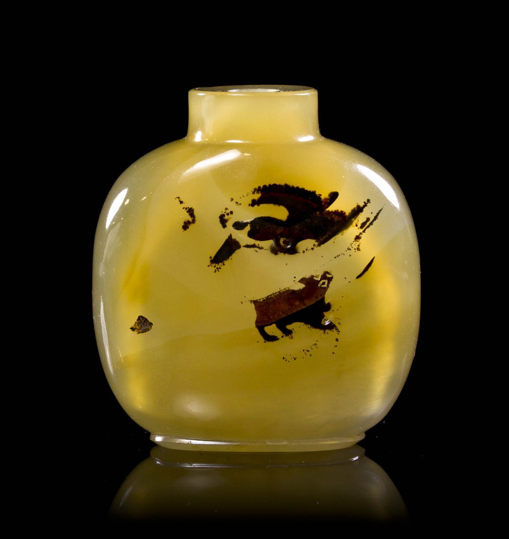 A Shadow Agate Snuff Bottle, Height of bottle 2 1/2 : A Shadow Agate Snuff Bottle, of compressed squared form having decoration depicting an eagle swooping above a dog. Height of bottle 2 1/2 inches.