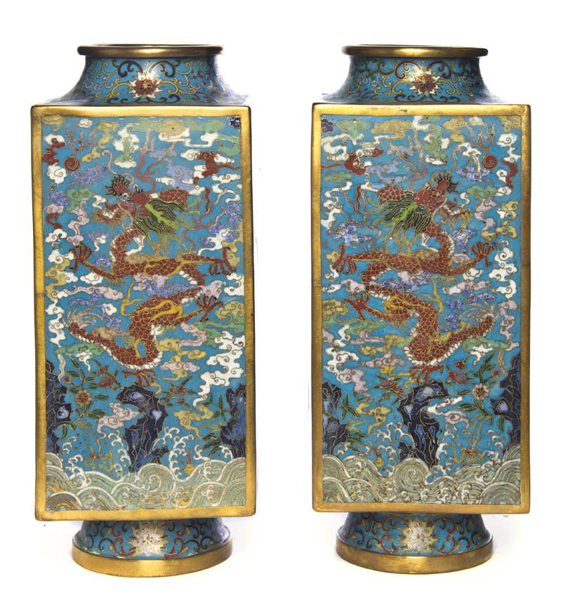A Pair of Chinese Cloisonne Square Vases, Height 12: A Pair of Chinese Cloisonne Square Vases, the rectangular sides each containing alternating images of phoenixes and dragons set atop a reserve of clouds and scrolling decoration above crashing waves, 