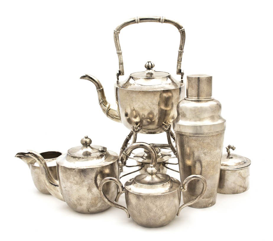 An Assembled Chinese Silver Tea Service, Height of: An Assembled Chinese Silver Tea Service, comprising a hot water kettle on stand with ivory insulators, a teapot, a creamer, a covered sugar, a waste bowl, a stoppered tea caddy and a cocktail shaker, 