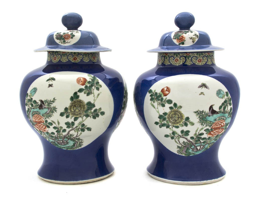 A Pair of Chinese Famille Verte Decorated Lidded G: A Pair of Chinese Famille Verte Decorated Lidded Ginger Jars, having cartouches with floral decoration atop a cobalt ground, having Qianlong mark and likely of the period. Height 13 3/4 inches. Proper