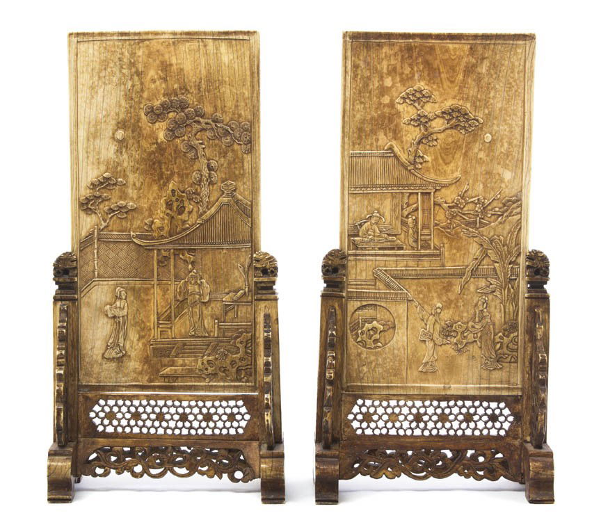 A Pair of Chinese Ivory Screens, Height overall 10: A Pair of Chinese Ivory Screens, of rectangular form with tea stained finish, having decoration in relief of figures in an outdoor gardern, one showing a man indoors playing a Chinese harp, the other