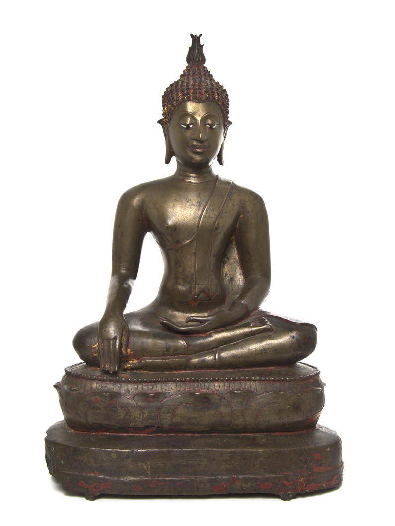A Southeast Asian Bronze Seated Figure of a Buddha: A Southeast Asian Bronze Seated Figure of a Buddha, the figure having a flame extending from the usnisa at the top of the head, with serene expression and mother-of-pearl and glass inset eyes, in a se