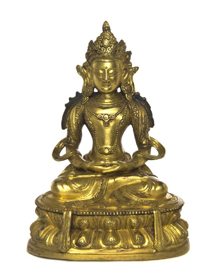 A Gilt Bronze Model of Guanyin, Height 7 1/4 inche: A Gilt Bronze Model of Guanyin, depicted wearing elaborate headdress, earrings and flowing scarves, with hair over the shoulders, raised upon a double lotus form base. Height 7 1/4 inches.