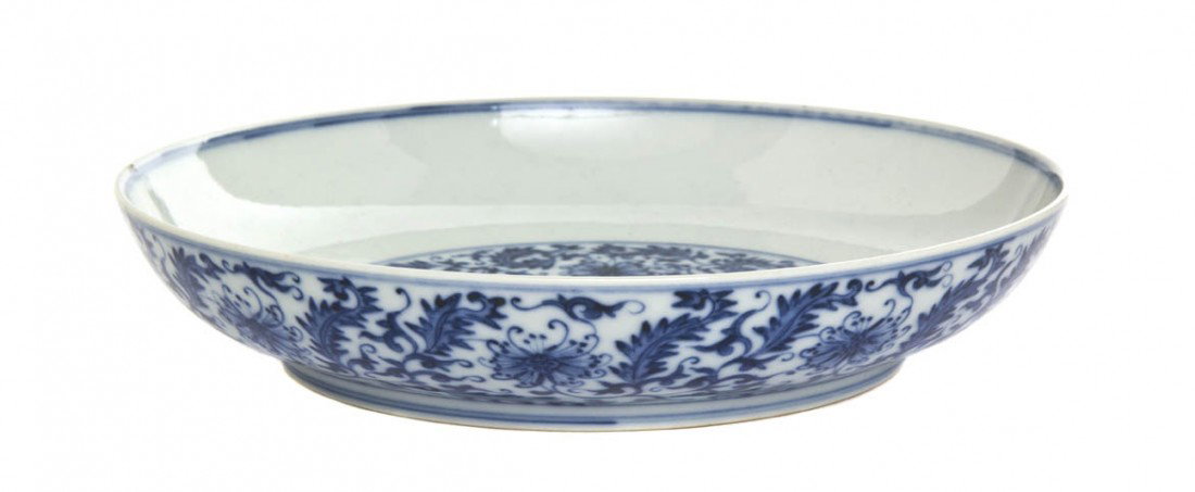 A Chinese Porcelain Dish, Diameter 8 1/4 inches.: A Chinese Porcelain Dish, the center having seven blossoms surrounded by scrolling leafy stems, the same design repeated in a band around the exterior, all within double line borders, with Xianfeng ma