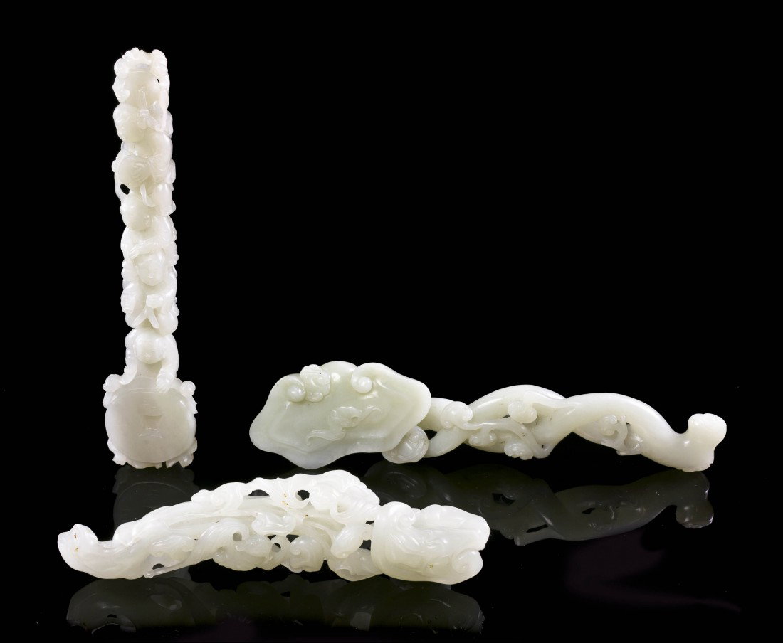 A Group of Three Jade Ruyi Scepters, Length of lon: A Group of Three Jade Ruyi Scepters, of celadon colored and near white stone, with pierce carved decoration throughout. Length of longest 7 3/4 inches. Property of a Private Collector, Chicago, Illino