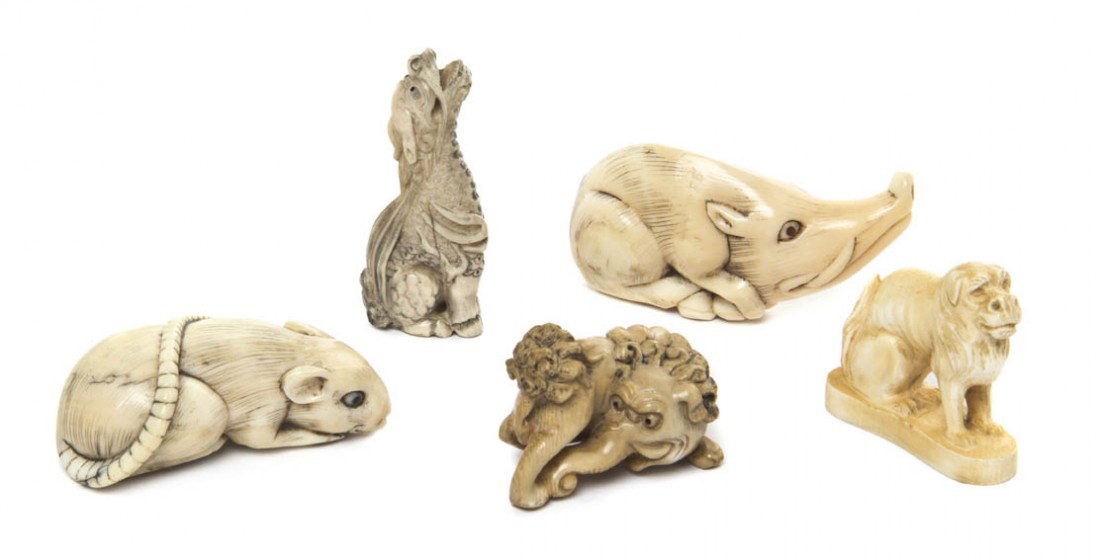 A Group of Five Ivory Animal Form Netsuke, Width o: A Group of Five Ivory Animal Form Netsuke, one depicting a boar with inset inlaid red eyes, one of a rat with inlaid horn eyes, one of a beast with a lion form body having an elephant trunk, one depic