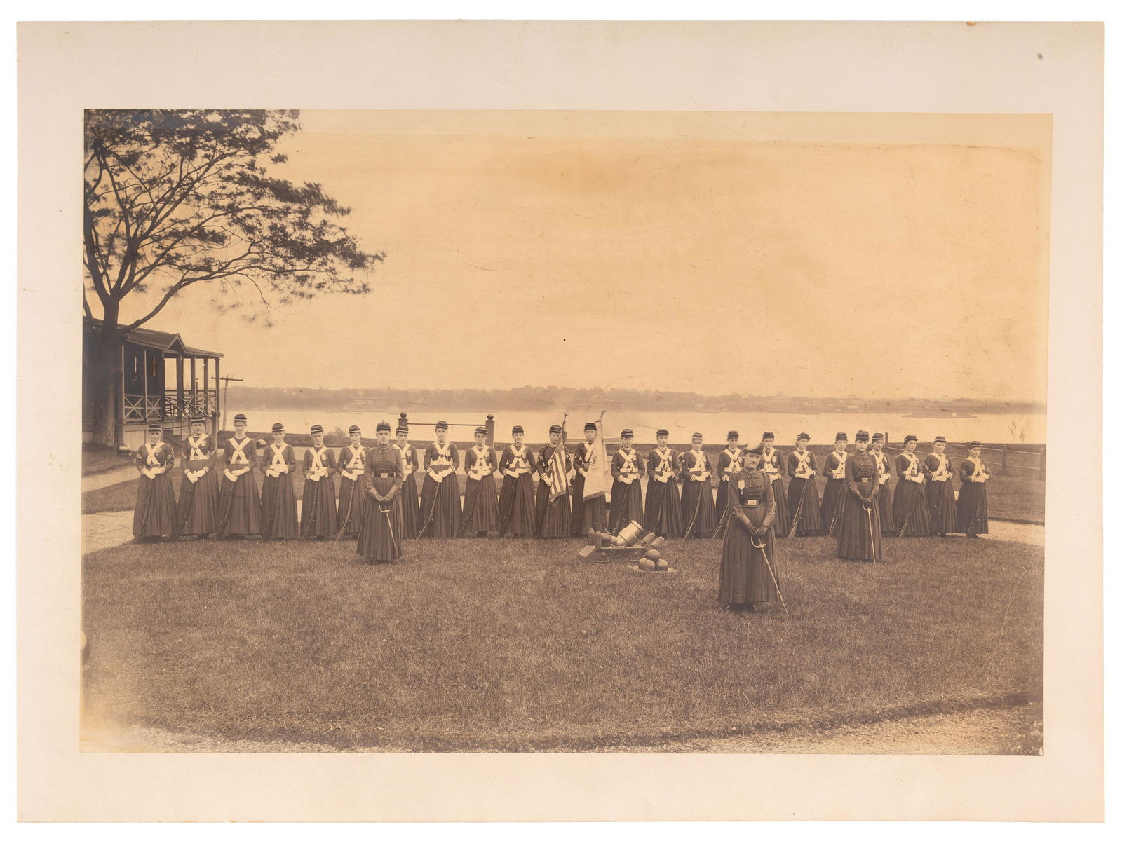[EARLY PHOTOGRAPHY]. Large format photograph of a group of women in uniform and armed, possibly (1 of 4)