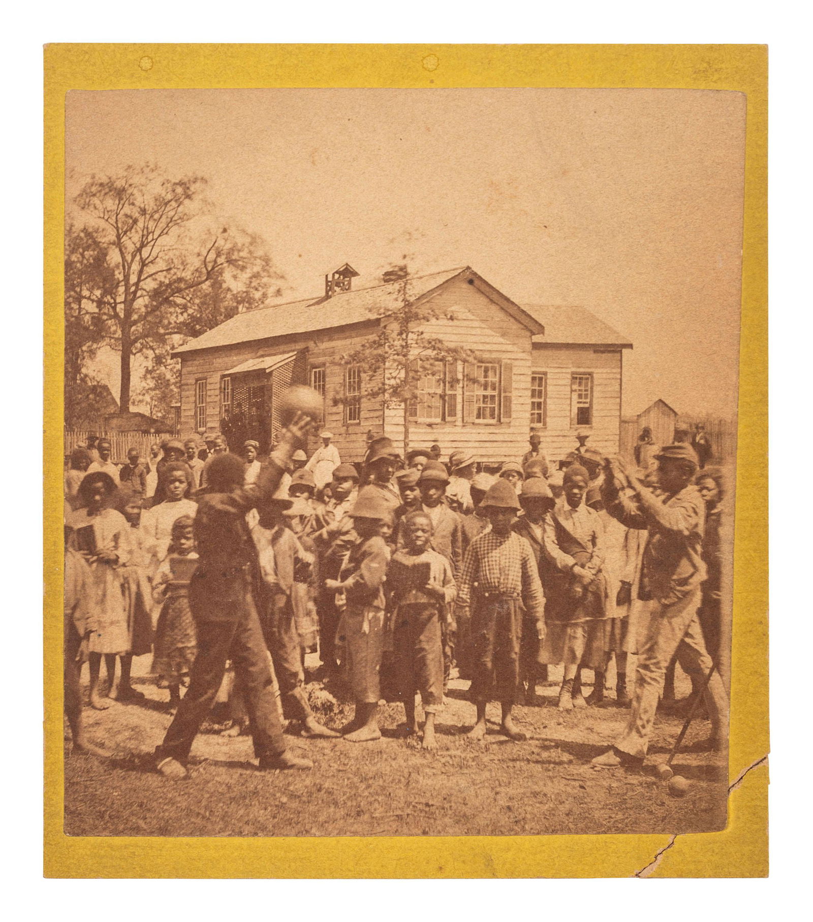 [EARLY PHOTOGRAPHY]. Mounted albumen photograph of African American children playing a game. Ca (1 of 2)