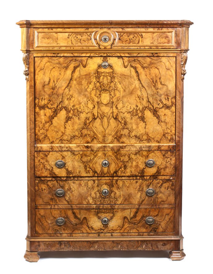 A Biedermeier Style Burr Walnut Secretaire a Abatta: A Biedermeier Style Burr Walnut Secretaire a Abattant, having a rectangular top with turret corners and a molded edge over a single drawer, the case with canted corners flanking a fall front writing s