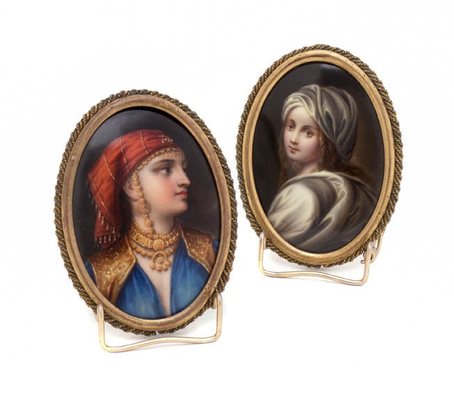 A Pair of Continental Portrait Miniatures on Porcel: A Pair of Continental Portrait Miniatures on Porcelain, of oval form, depicting a gentleman and a lady, each set in a gilt frame. Height 3 3/4 inches.