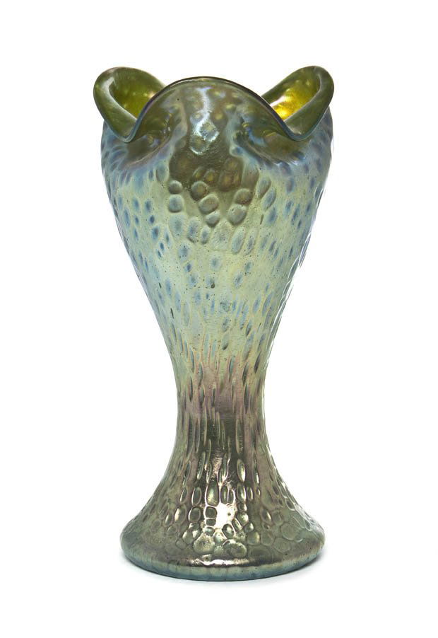 A Loetz Iridescent Glass Vase, Height 11 3/4 inche: A Loetz Iridescent Glass Vase, having a ruffled bulbous top, in iridescent green transitioning to the waisted stem ending in a circular foot. Height 11 3/4 inches.
