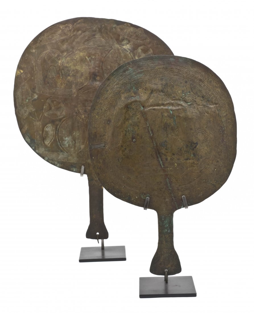 Two Hammered Brass Fans, Height of largest 19 inch: Two Hammered Brass Fans, each having a carved decorative pattern and held with stand. Height of largest 19 inches. Property from the Collection of Roberta and Jerome Hirtenstein, Northbrook, Illinois