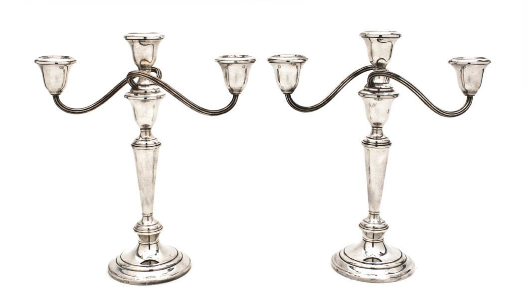 A Pair of American Silver Three-Light Candelabras,: A Pair of American Silver Three-Light Candelabras, Gorham, weighted, each candelabra having two scrolling arms over the central stem, raised on a circular foot. Height 11 1/2 inches.
