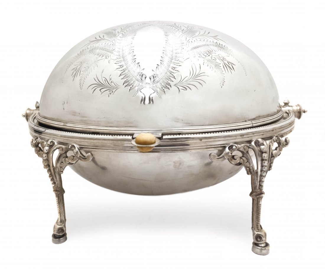 An English Silverplate Bacon Warmer, Height 7 1/2 : An English Silverplate Bacon Warmer, of oval form with engraved fern decoration, raised on pierced scrolling foliate legs. Height 7 1/2 x width 12 1/2 x depth 10 inches. Property from the Collection o