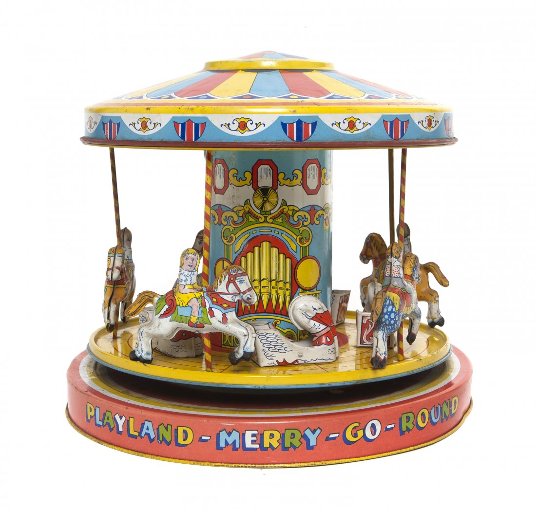 A J. Chein & Co Pressed Tin Wind-Up Toy, Height 9 : A J. Chein & Co Pressed Tin Wind-Up Toy, of a Playland Merry-Go-Round, with children on horses and swan seats. Height 9 1/2 inches.
