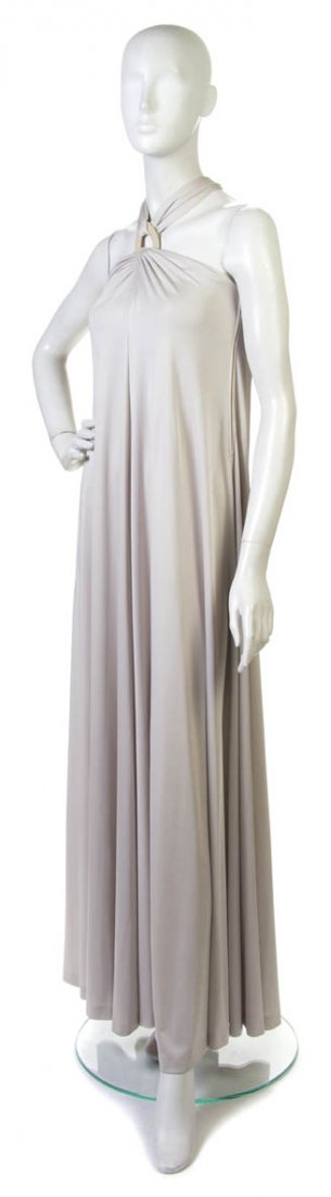 A Donald Brooks Taupe Jersey Evening Gown, Size 8.: A Donald Brooks Taupe Jersey Evening Gown, with halter neckline and goldtone buckle detail. Labeled: Donald Brooks. Size 8.