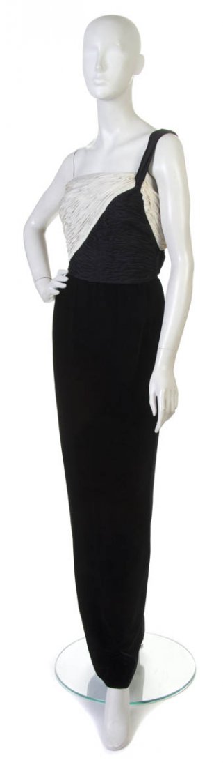 A Valentino Black Velvet and Silk Evening Gown, Si: A Valentino Black Velvet and Silk Evening Gown, single shoulder with pleated black and white silk bodice. Labeled: Valentino. Size 8.