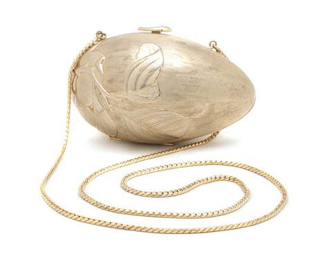 A Judith Leiber Goldtone Egg Evening Bag, 6 x 3 in: A Judith Leiber Goldtone Egg Evening Bag, hardsided in a floral motif. Stamped: Judith Leiber. 6 x 3 inches.