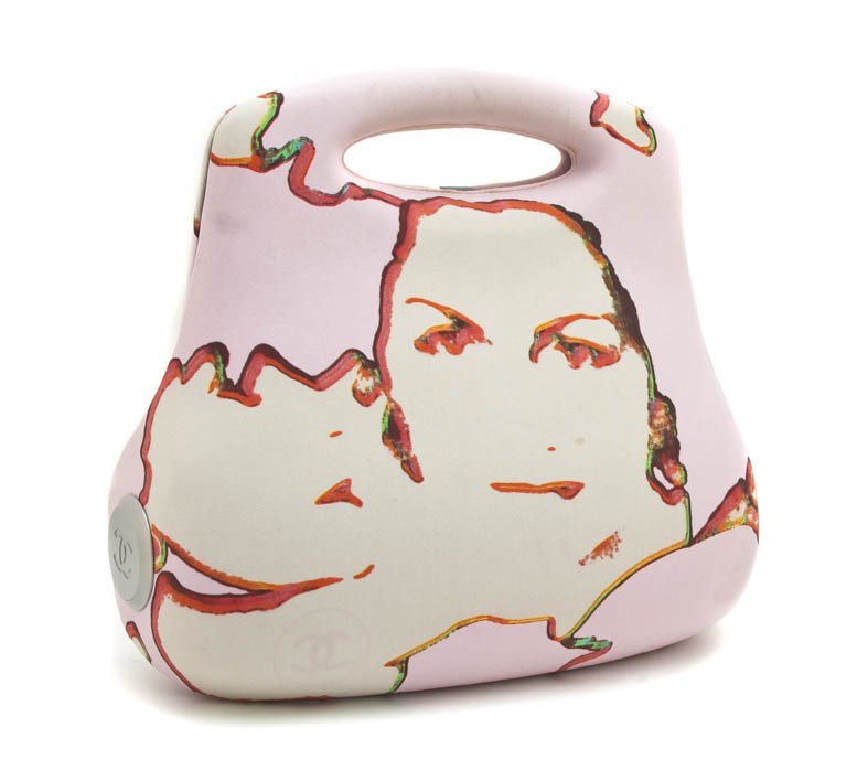 A Chanel Pressed Silk Hardsided 'Coco' Bag, 11 1/2: A Chanel Pressed Silk Hardsided 'Coco' Bag, with an abstract print of Coco Chanel's face. Stamped: Chanel. 11 1/2 x 12 inches.