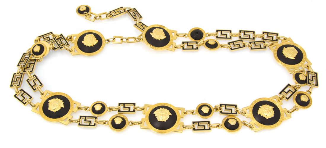 A Gianni Versace Black Enamel and Leather Goldtone: A Gianni Versace Black Enamel and Leather Goldtone Chainlink Belt, with all-over Medusas and Greek Keys. Stamped: Gianni Versace. Property from a Lady, Chicago, Illinois