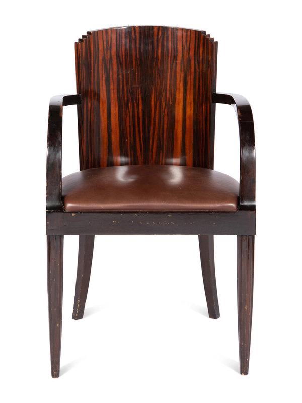 A French Art Deco Macassar Ebony Fauteuil: A French Art Deco Macassar Ebony Fauteuil Possibly by Maison Dominique, Circa 1930-40 with brown leather seat.Height 34 3/4 x width 22 x depth 21 inches. Property from a David Collins-Desig