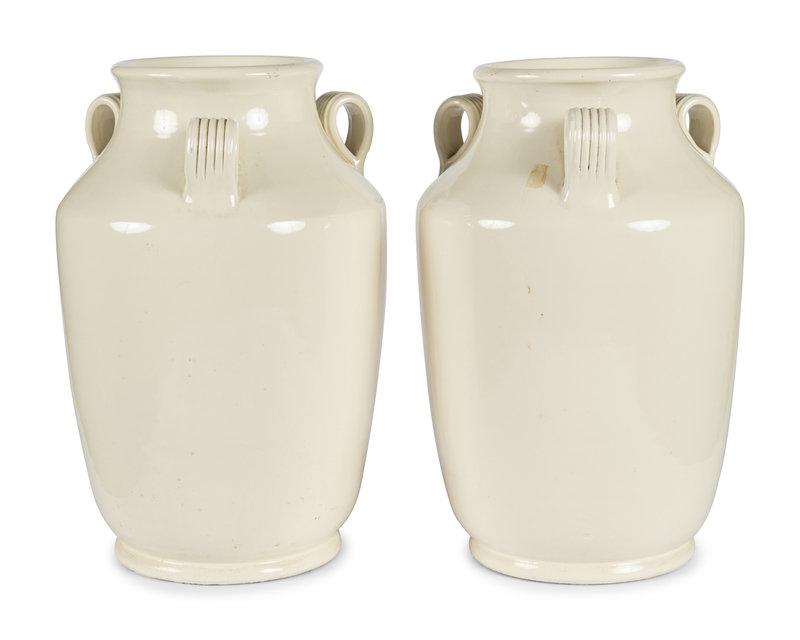A Pair of Cream Glazed Earthenware Vases: A Pair of Cream Glazed Earthenware Vases 20th Century with ring handles.Height 18 1/2 inches. Property from a David Collins-Designed New York Residence Condition<