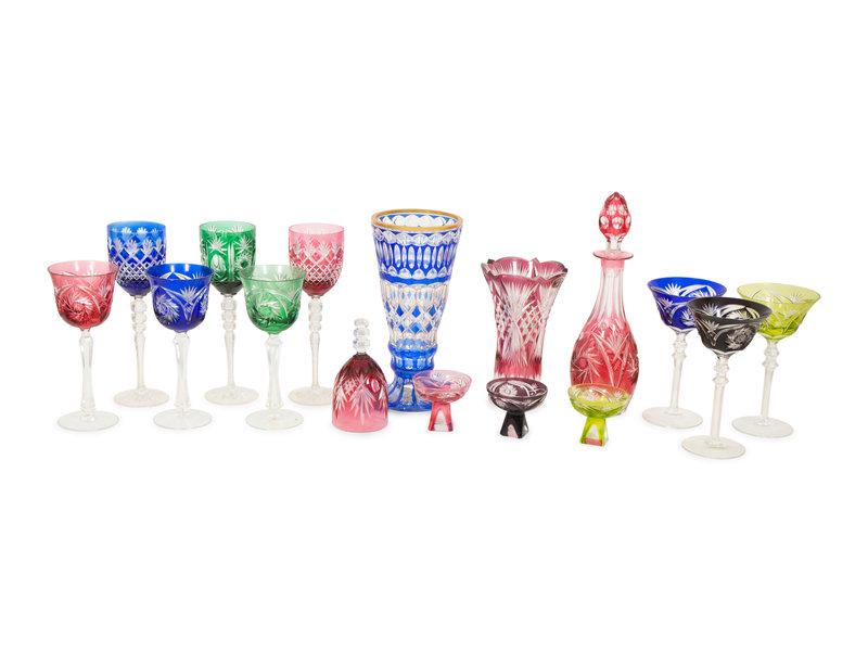 A Collection of Bohemian Colored Cut-to-Clear Glass Articles: A Collection of Bohemian Colored Cut-to-Clear Glass Articles 19th/20th Century comprising two vases, one decanter, 18 stemmed glasses, 7 sherbets and a dinner bell; 29 items total.Height of decanter 1