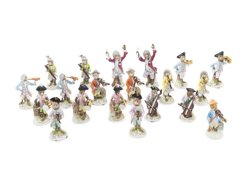 An Assembled Group of Nineteen Sitzendorf Porcelain Monkey Band Figures: An Assembled Group of Nineteen Sitzendorf Porcelain Monkey Band Figures 19th Century comprising two composers, two violinists, two trumpet players, two French horn players, two bassoon players, three