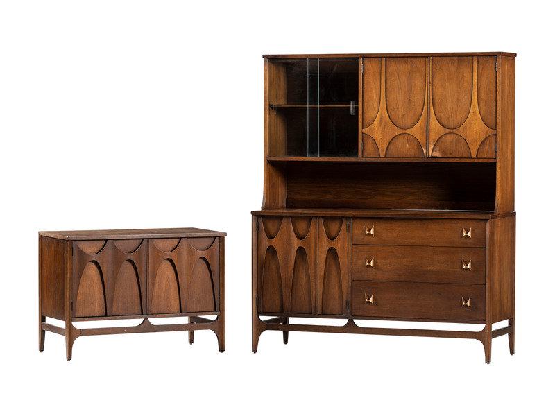 A Broyhill Brasilia Walnut Credenza and Hutch : A Broyhill Brasilia Walnut Credenza and Hutch 20th Century Height of hutch 65 1/4 x width 54 x depth 19 inches. Height of credenza 26 1/4 x width 37 x depth 17 inches. This lot
