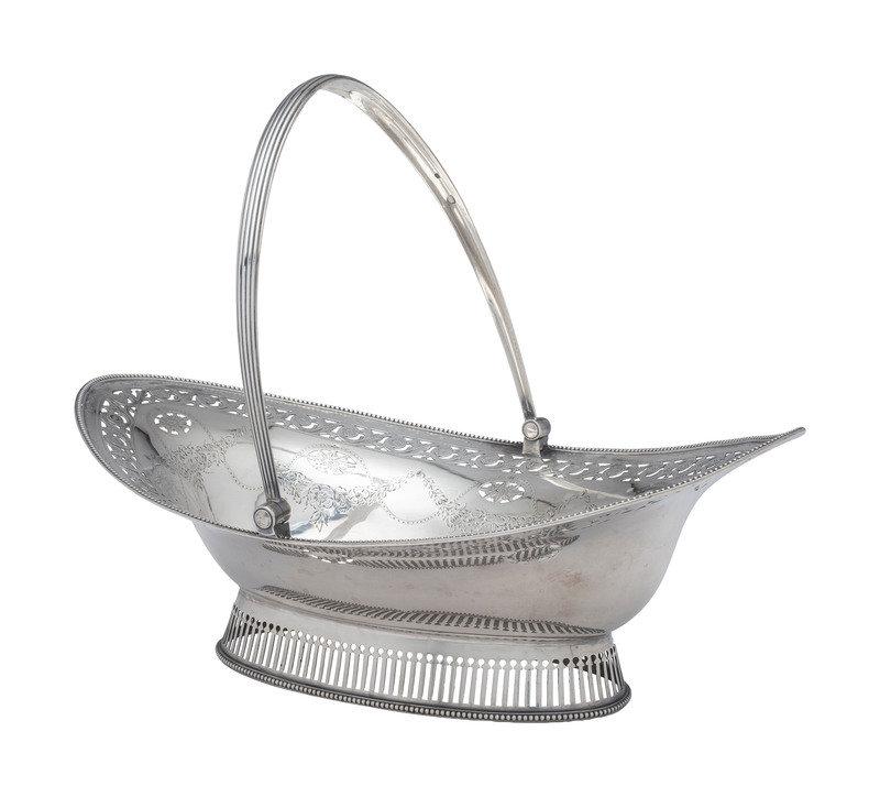 A George III Silver Centerpiece Basket: A George III Silver Centerpiece Basket Robert Hennell I, London, 1787 with full hallmarks to rim23 ozt 1 dwtHeight 5 1/8 (excluding handle) x length 13 3/4 x width 9 1/2 inches. This