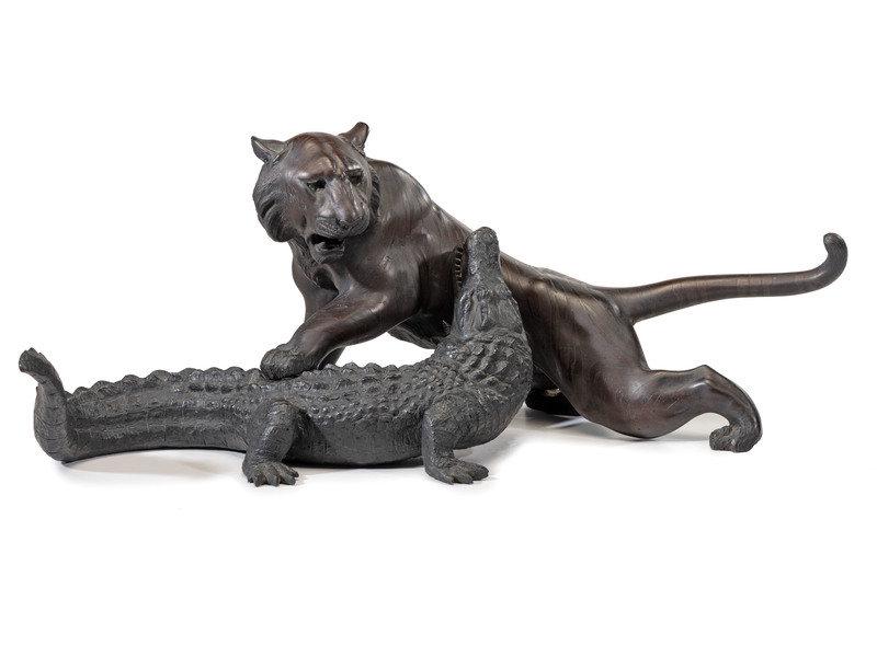 A Japanese Meiji Bronze Tiger and Alligator Sculptural Group: A Japanese Meiji Bronze Tiger and Alligator Sculptural Group Late 19th/20th Century unmarked. Lenghth 23 inches. This lot is located in Cincinnati. Property from a Michigan Collector</