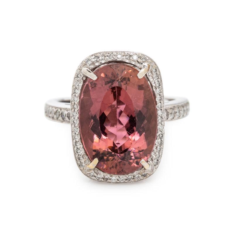 PINK TOURMALINE AND DIAMOND RING: PINK TOURMALINE AND DIAMOND RING Containing one oval mixed cut pink tourmaline measuring approximately 15.90 x 11.20 x 7.90 mm and 57 round brilliant cut diamonds weighing approximately 0.25 carat tot