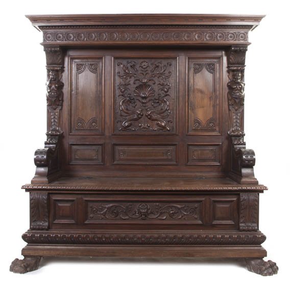 A Renaissance Revival Carved Walnut Hall Bench, He: A Renaissance Revival Carved Walnut Hall Bench, the stepped cornice with egg and dart decoration over the paneled back centered with a griffin upon a shell and foliate carved panel flanked by carved c