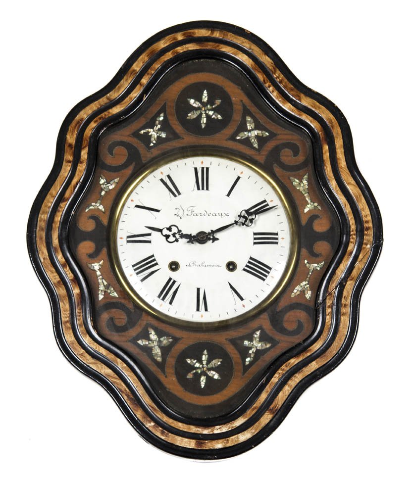 A Victorian Ebonized and Mother-of-Pearl Inset Wal: A Victorian Ebonized and Mother-of-Pearl Inset Wall Clock, of shaped oval form having a circular dial with Roman numerals. Height 24 1/4 x width 19 inches. Property from O'Hara's Gallery, Chicago, Ill