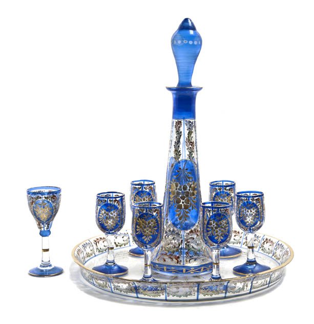 A Bohemian Cut and Enameled Glass Drinks Set, Heig: A Bohemian Cut and Enameled Glass Drinks Set, comprising seven cordials, a decanter and tray. Height of decanter 11 inches. Property from the Collection of Nancy B. and Peter G. Kohler, Kohler, Wiscon