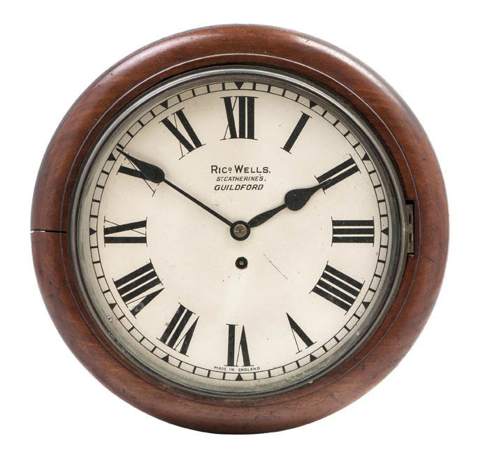 An English Mahogany Wall Clock, Richard Wells, Dia: An English Mahogany Wall Clock, Richard Wells, of circular form, the dial with Roman numerals, having time only fusee movement. Diameter 15 1/2 x depth 5 1/2 inches.