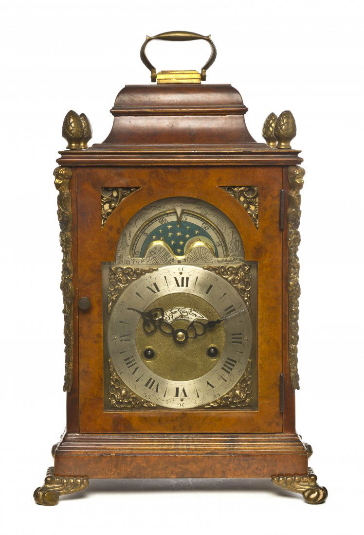 A Burlwood and Gilt Metal Bracket Clock, John Tayl: A Burlwood and Gilt Metal Bracket Clock, John Taylor, works London, case Hollard, the face with moon phase dial and steel chapter ring, having Roman hours and Arabic minutes. Height 16 inches.