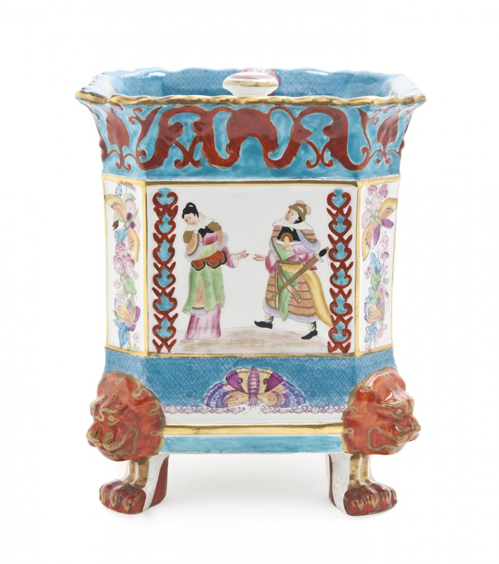 An English Ironstone Covered Cache Pot, Masons, He: An English Ironstone Covered Cache Pot, Masons, of squared form with figural and Chinoiserie decoration throughout, raised on four lion mask monoped feet. Height 6 3/4 inches.