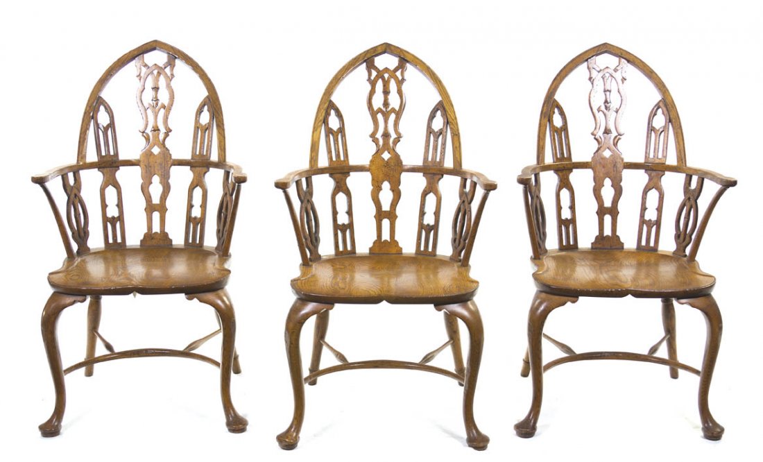 A Set of Three Windsor Armchairs, Height 41 inches: A Set of Three Windsor Armchairs, each having a lancet arch crest rail over the pierced baluster backsplat, raised on cabriole legs joined by stretchers. Height 41 inches.