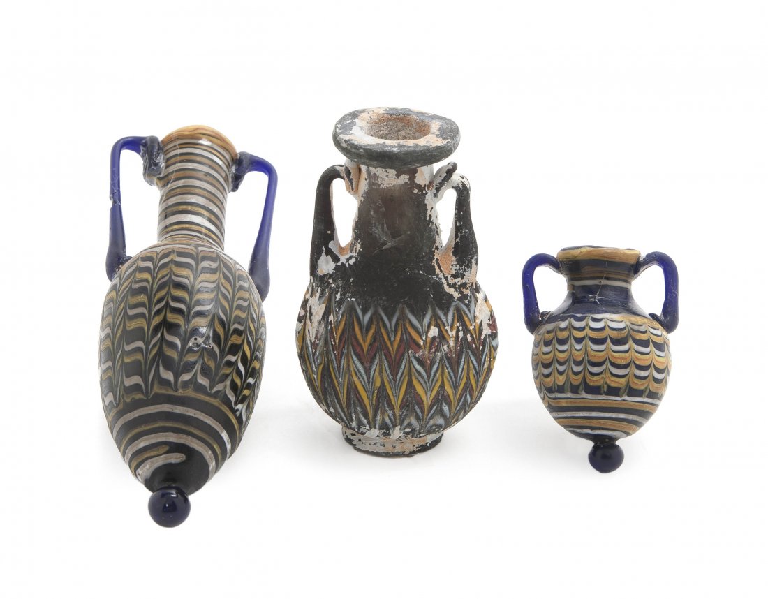 Three Roman Glass Bottles, Height of tallest 6 1/: Three Roman Glass Bottles, each of handled form with polychrome pulled decoration. Height of tallest 6 1/8 inches.